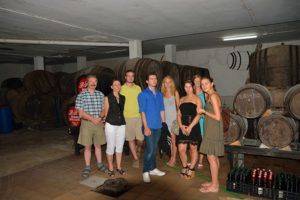 Group of people studying Spanish at a wine tasting session in a Sherry winery in Prado del Rey